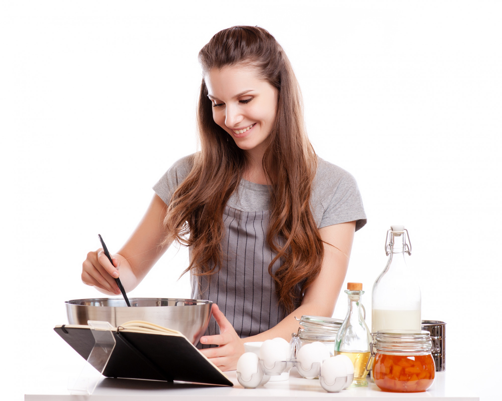 Instructor guiding student over stove
